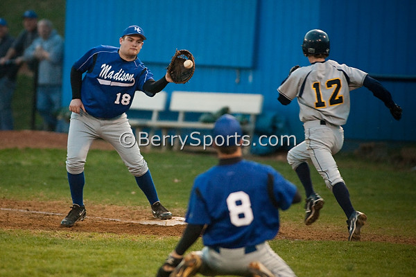 3-823-0572 First baseman Jacob Houser takes a throw from pitcher Matt Racer. Matt dove to stop a Fluvanna bunt, throwing the batter out from his knees.