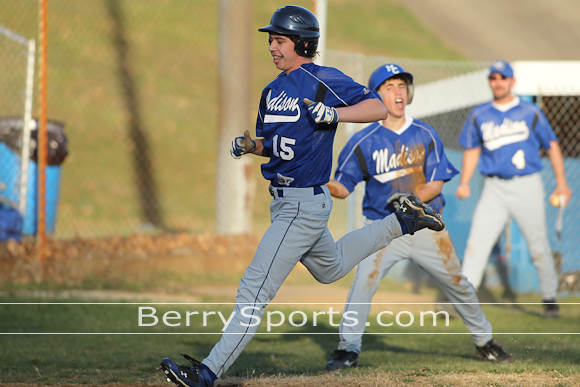 4-1085-0595 Ryan Taylor scores the winning run for the JV Mountaineers. (click the picture to go to the gallery)